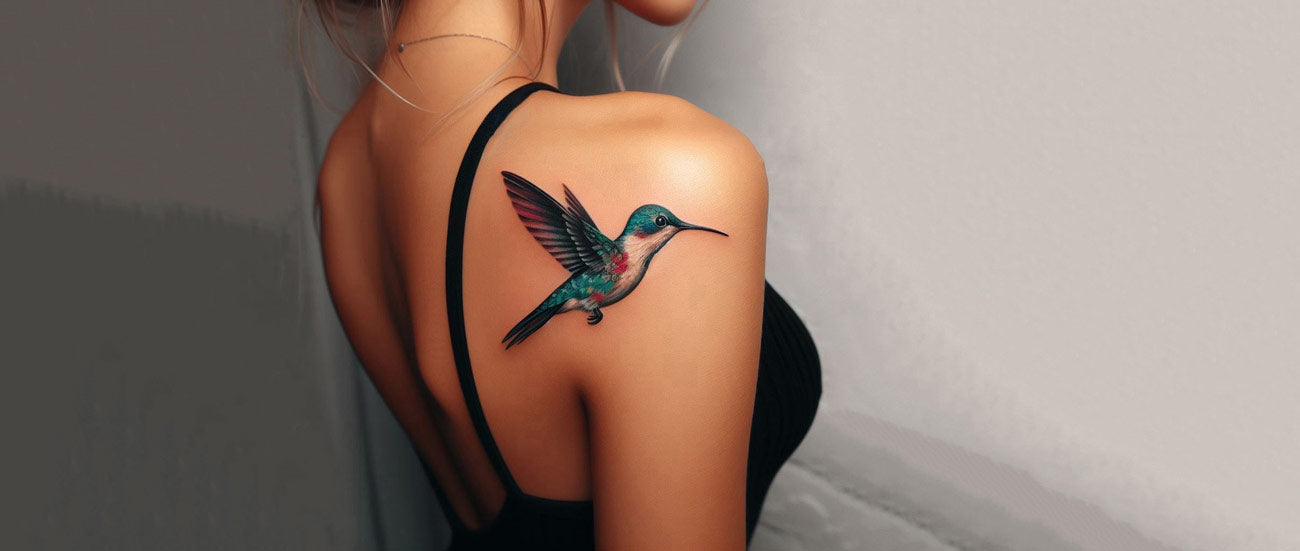 Hummingbird And Cherry Blossom Branch Tattoo On Lower Back
